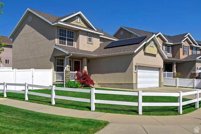7526 S Park Maple Dr, West Jordan, UT 84081 - view of front facade featuring stucco siding, roof mounted solar panels, and driveway