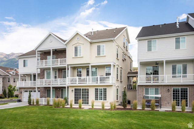 5149 N Edgewood Dr, Provo, UT 84604 - back of property with a balcony, ceiling fan, and a yard