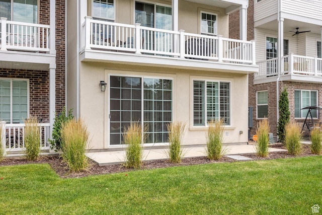 5149 N Edgewood Dr, Provo, UT 84604 - view of side of property featuring stucco siding, a yard, and brick siding