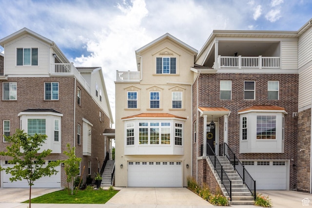 5149 N Edgewood Dr, Provo, UT 84604 - view of front of house featuring stairway, driveway, an attached garage, and a balcony