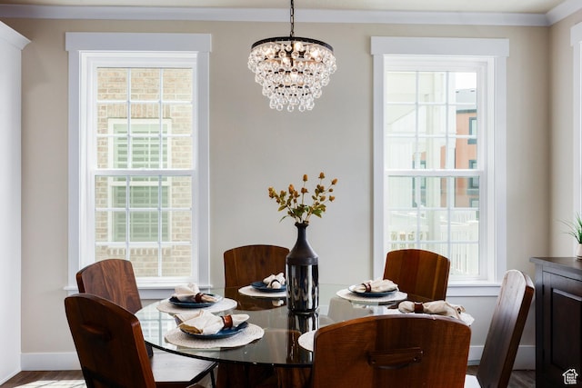 5149 N Edgewood Dr, Provo, UT 84604 - dining space featuring a chandelier, plenty of natural light, and crown molding