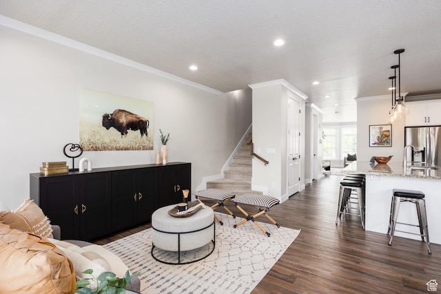 5149 N Edgewood Dr, Provo, UT 84604 - living area with recessed lighting, stairs, dark wood finished floors, and ornamental molding