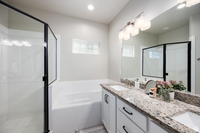 5149 N Edgewood Dr, Provo, UT 84604 - bathroom with double vanity, a stall shower, a garden tub, and recessed lighting