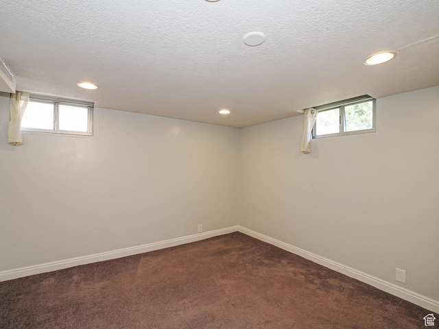 2375 E Redondo Ave, Salt Lake City, UT 84108 - below grade area featuring recessed lighting, dark colored carpet, healthy amount of natural light, and a textured ceiling