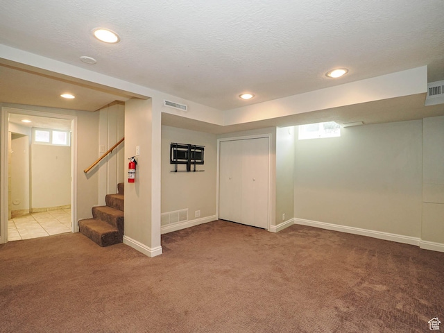 2375 E Redondo Ave, Salt Lake City, UT 84108 - basement featuring carpet floors, plenty of natural light, stairway, recessed lighting, and a textured ceiling