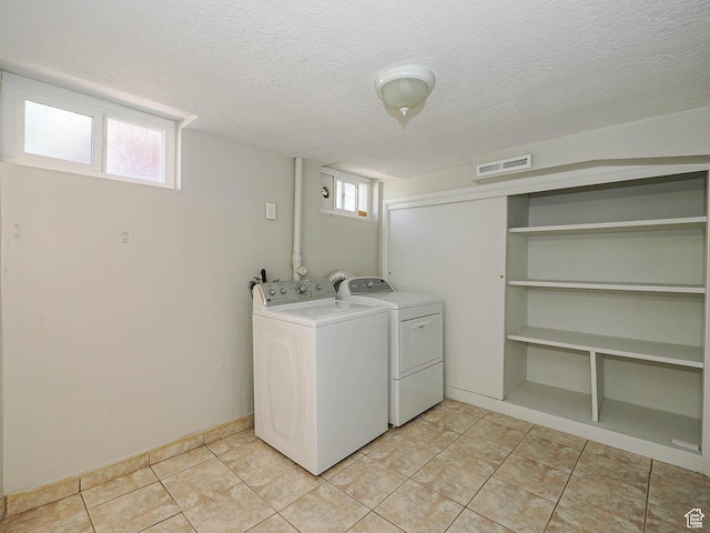 2375 E Redondo Ave, Salt Lake City, UT 84108 - laundry area featuring independent washer and dryer, a textured ceiling, and light tile patterned floors