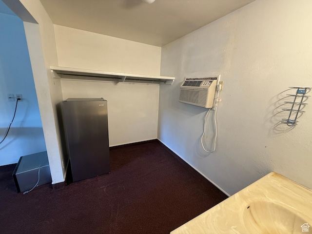 1170 S Cove View Rd, Richfield, UT 84701 - walk in closet featuring an AC wall unit and dark carpet