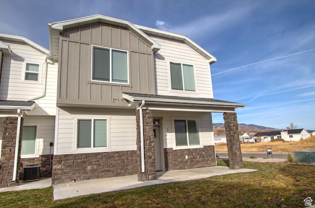 130 W Seasons Loop Upper, Upper, Garden City, UT 84028 - craftsman-style home with board and batten siding, stone siding, and a front yard