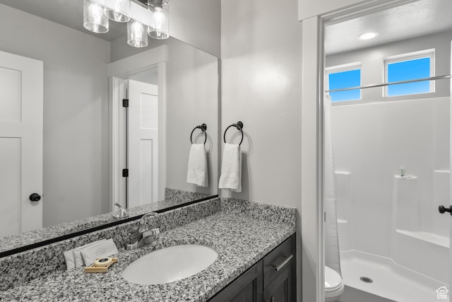 130 W Seasons Loop Upper, Upper, Garden City, UT 84028 - bathroom featuring vanity and a stall shower