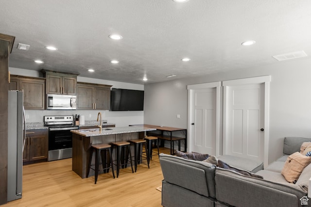 130 W Seasons Loop Upper, Upper, Garden City, UT 84028 - living area featuring light wood-style flooring and recessed lighting