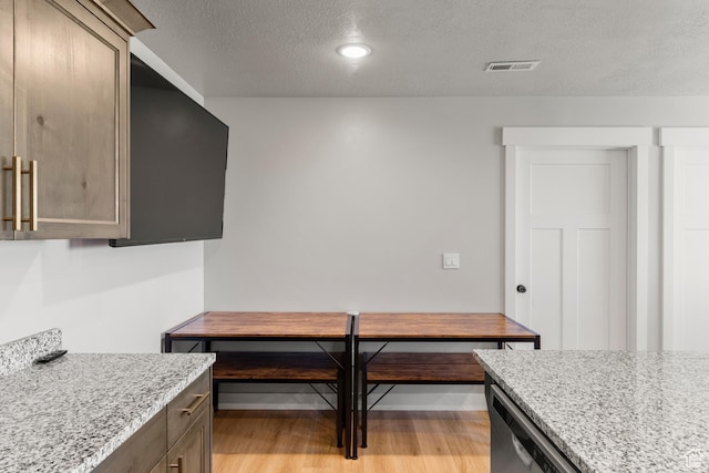 130 W Seasons Loop Upper, Upper, Garden City, UT 84028 - kitchen with a textured ceiling, light wood-style flooring, light stone countertops, recessed lighting, and stainless steel dishwasher