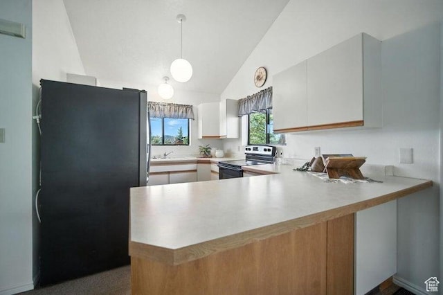 214 S Terry Pkwy, Pine Valley, UT 84781 - kitchen featuring range with electric stovetop, freestanding refrigerator, a peninsula, light countertops, and vaulted ceiling