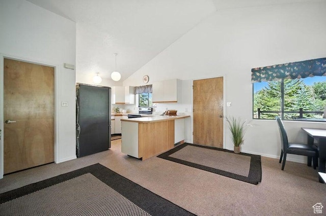214 S Terry Pkwy, Pine Valley, UT 84781 - kitchen featuring stainless steel electric range oven, freestanding refrigerator, high vaulted ceiling, a peninsula, and light countertops