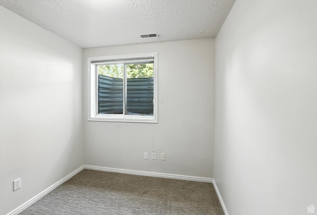 1298 Eastridge Cir, Logan, UT 84321 - carpeted spare room with a textured ceiling and baseboards