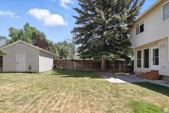 1298 Eastridge Cir, Logan, UT 84321 - fenced backyard with entry steps, an outbuilding, and a patio