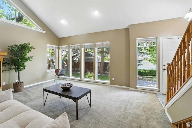 1298 Eastridge Cir, Logan, UT 84321 - living area featuring carpet floors, stairs, plenty of natural light, high vaulted ceiling, and recessed lighting