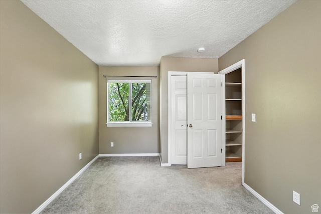1298 Eastridge Cir, Logan, UT 84321 - unfurnished bedroom with carpet floors, a textured ceiling, and a closet
