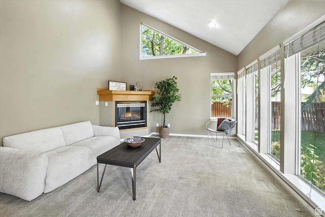1298 Eastridge Cir, Logan, UT 84321 - living area with plenty of natural light, carpet floors, a glass covered fireplace, and high vaulted ceiling
