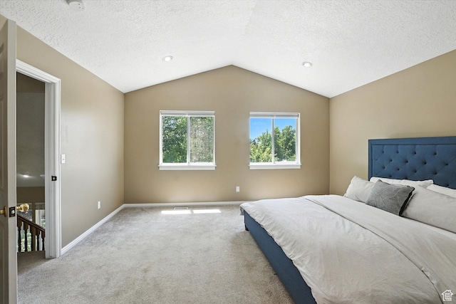 1298 Eastridge Cir, Logan, UT 84321 - bedroom featuring carpet, lofted ceiling, and a textured ceiling