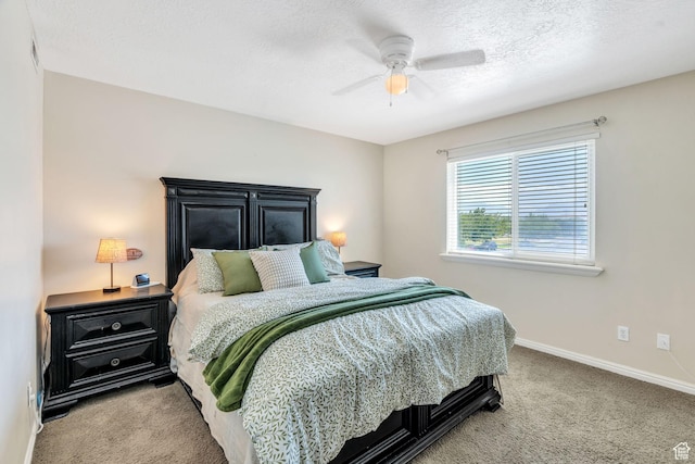 8246 N Cedar Springs Rd E Unit 8, Eagle Mountain, UT 84005 - bedroom with carpet flooring, a ceiling fan, and a textured ceiling