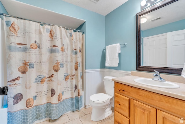8246 N Cedar Springs Rd E Unit 8, Eagle Mountain, UT 84005 - bathroom with wainscoting, tile patterned flooring, vanity, and a shower with curtain