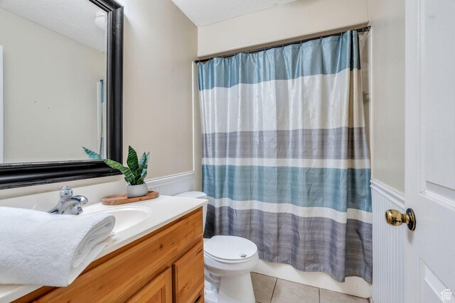 8246 N Cedar Springs Rd E Unit 8, Eagle Mountain, UT 84005 - bathroom with vanity, a wainscoted wall, and tile patterned flooring