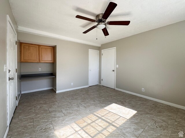 1790 W Homestead Farm Ln Unit 4, West Valley City, UT 84119 - empty room featuring ceiling fan and baseboards