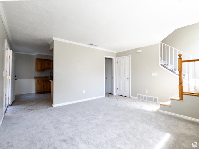 1790 W Homestead Farm Ln Unit 4, West Valley City, UT 84119 - unfurnished living room featuring light colored carpet, stairs, and crown molding