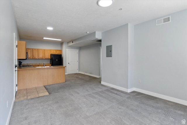 75 E 200 N Unit 206, Provo, UT 84606 - kitchen with electric panel, freestanding refrigerator, light colored carpet, a peninsula, and open floor plan