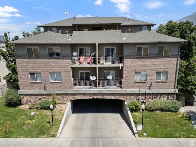 75 E 200 N Unit 206, Provo, UT 84606 - view of building exterior featuring driveway and an attached garage