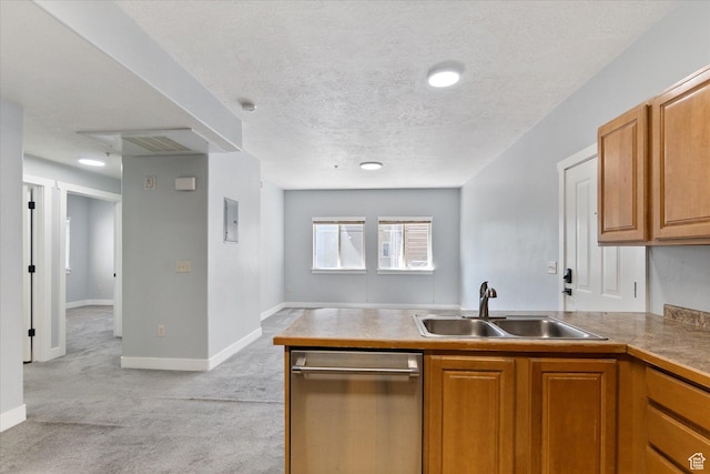 75 E 200 N Unit 206, Provo, UT 84606 - kitchen featuring dishwasher, a peninsula, light carpet, brown cabinets, and a textured ceiling