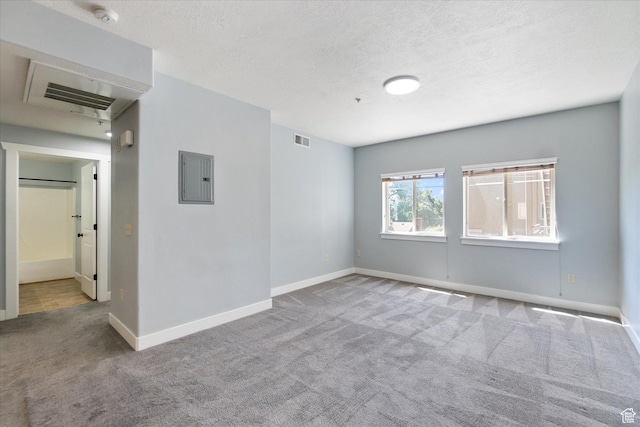 75 E 200 N Unit 206, Provo, UT 84606 - unfurnished room featuring carpet floors, electric panel, a smoke detector, and a textured ceiling