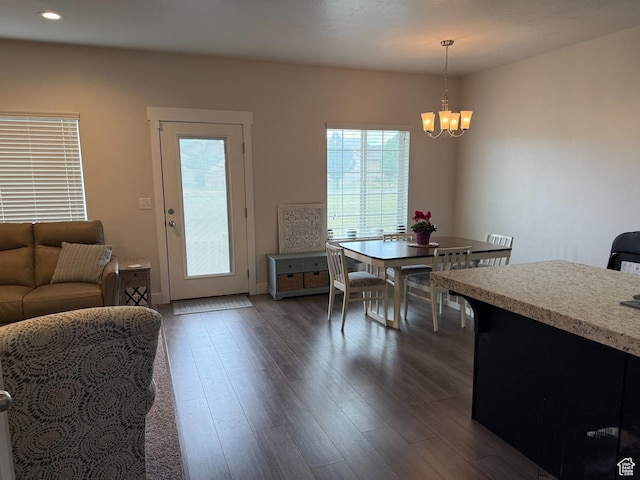 7579 N Cottage Ln, Eagle Mountain, UT 84005 - dining room with healthy amount of natural light, a chandelier, dark wood-style flooring, and recessed lighting