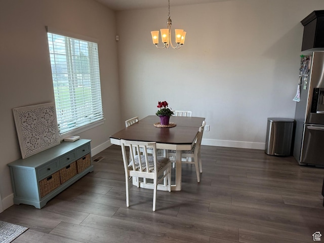 7579 N Cottage Ln, Eagle Mountain, UT 84005 - dining area with a chandelier and dark wood-style flooring