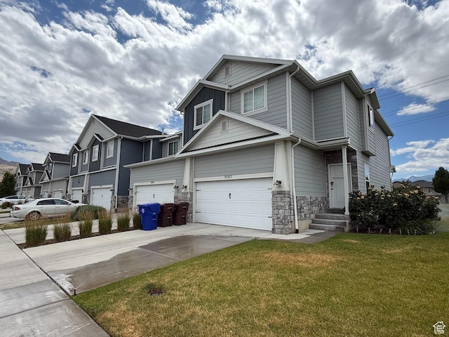 7579 N Cottage Ln, Eagle Mountain, UT 84005 - view of front of house with an attached garage, stone siding, driveway, a front yard, and a residential view
