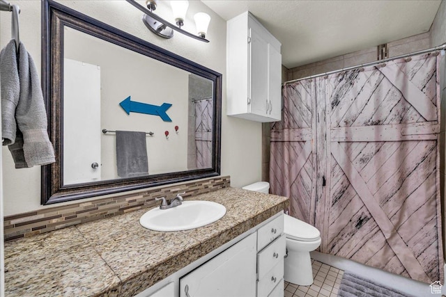120 N Scenic Dr E, Washington, UT 84780 - bathroom with vanity, backsplash, tile patterned floors, and a shower with shower curtain