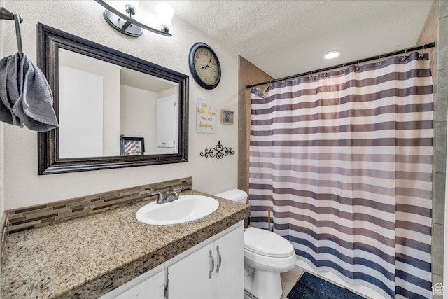 120 N Scenic Dr E, Washington, UT 84780 - full bath featuring vanity, a textured ceiling, a shower with curtain, and backsplash
