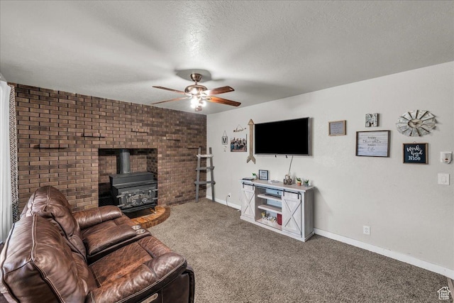 120 N Scenic Dr E, Washington, UT 84780 - living area featuring a wood stove, carpet floors, a ceiling fan, and a textured ceiling