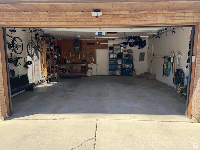 453 Sheridan Cir, Centerville, UT 84014 - garage featuring wooden ceiling, a workshop area, and electric panel