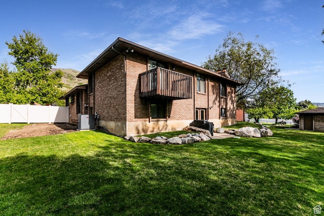 453 Sheridan Cir, Centerville, UT 84014 - back of house featuring brick siding and a balcony