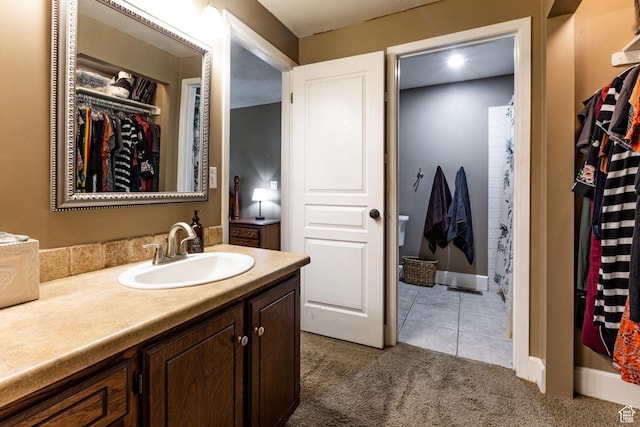453 Sheridan Cir, Centerville, UT 84014 - full bathroom with vanity, tile patterned floors, and a walk in closet