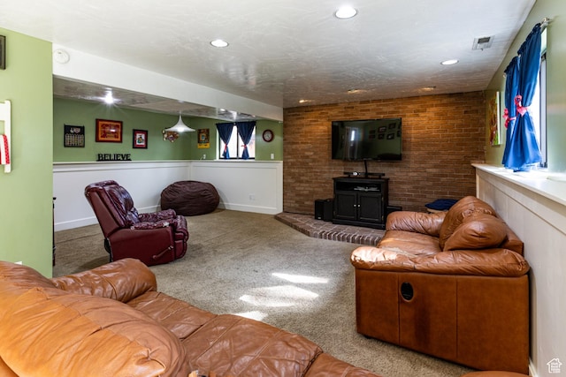 453 Sheridan Cir, Centerville, UT 84014 - living area with carpet flooring, recessed lighting, a wainscoted wall, and brick wall