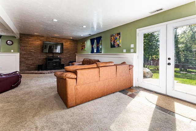 453 Sheridan Cir, Centerville, UT 84014 - living area featuring french doors, a wood stove, and recessed lighting