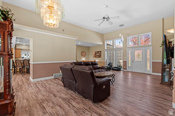 13032 S 1300 W, Riverton, UT 84065 - living area with wood finished floors, plenty of natural light, ceiling fan, and a high ceiling