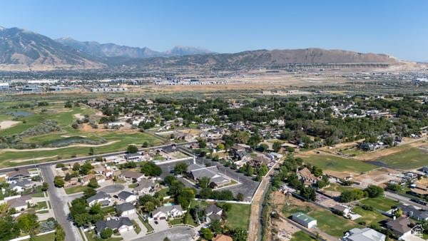 13032 S 1300 W, Riverton, UT 84065 - aerial overview of property's location featuring a mountain backdrop and nearby suburban area