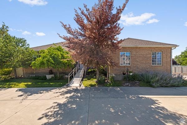 13032 S 1300 W, Riverton, UT 84065 - view of property hidden behind natural elements with brick siding