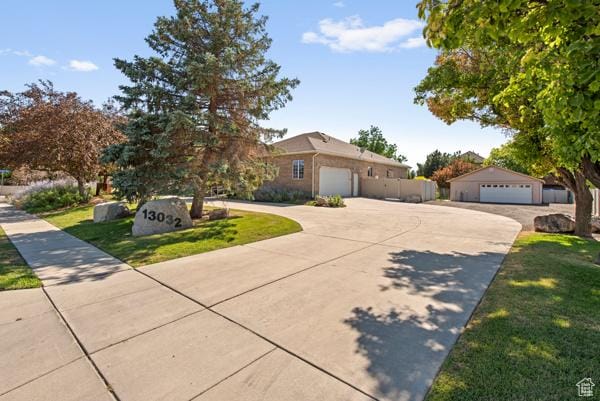 13032 S 1300 W, Riverton, UT 84065 - view of front of home featuring driveway and a front lawn