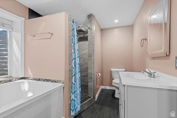13032 S 1300 W, Riverton, UT 84065 - bathroom featuring a shower stall, vanity, a garden tub, wood finished floors, and recessed lighting