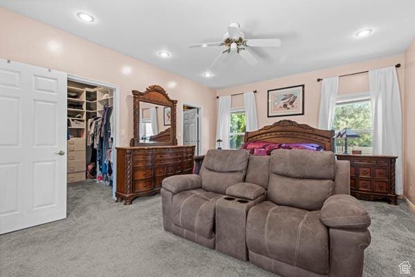 13032 S 1300 W, Riverton, UT 84065 - bedroom featuring light colored carpet, a spacious closet, multiple windows, a ceiling fan, and recessed lighting