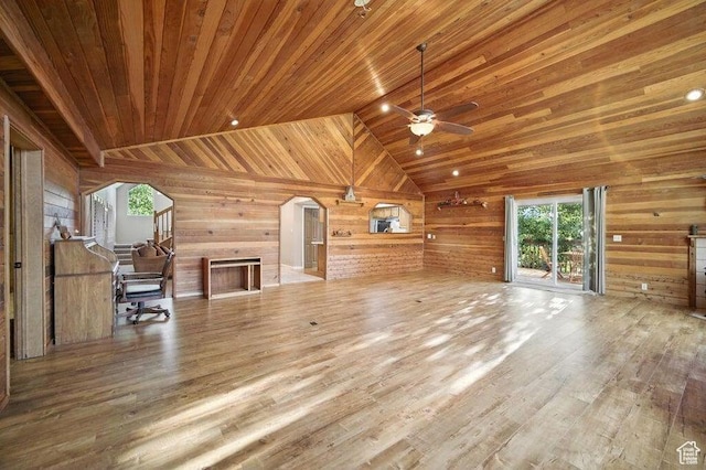 10 S 900 E, Pine Valley, UT 84781 - unfurnished living room with a ceiling fan, arched walkways, healthy amount of natural light, wood walls, and wood finished floors